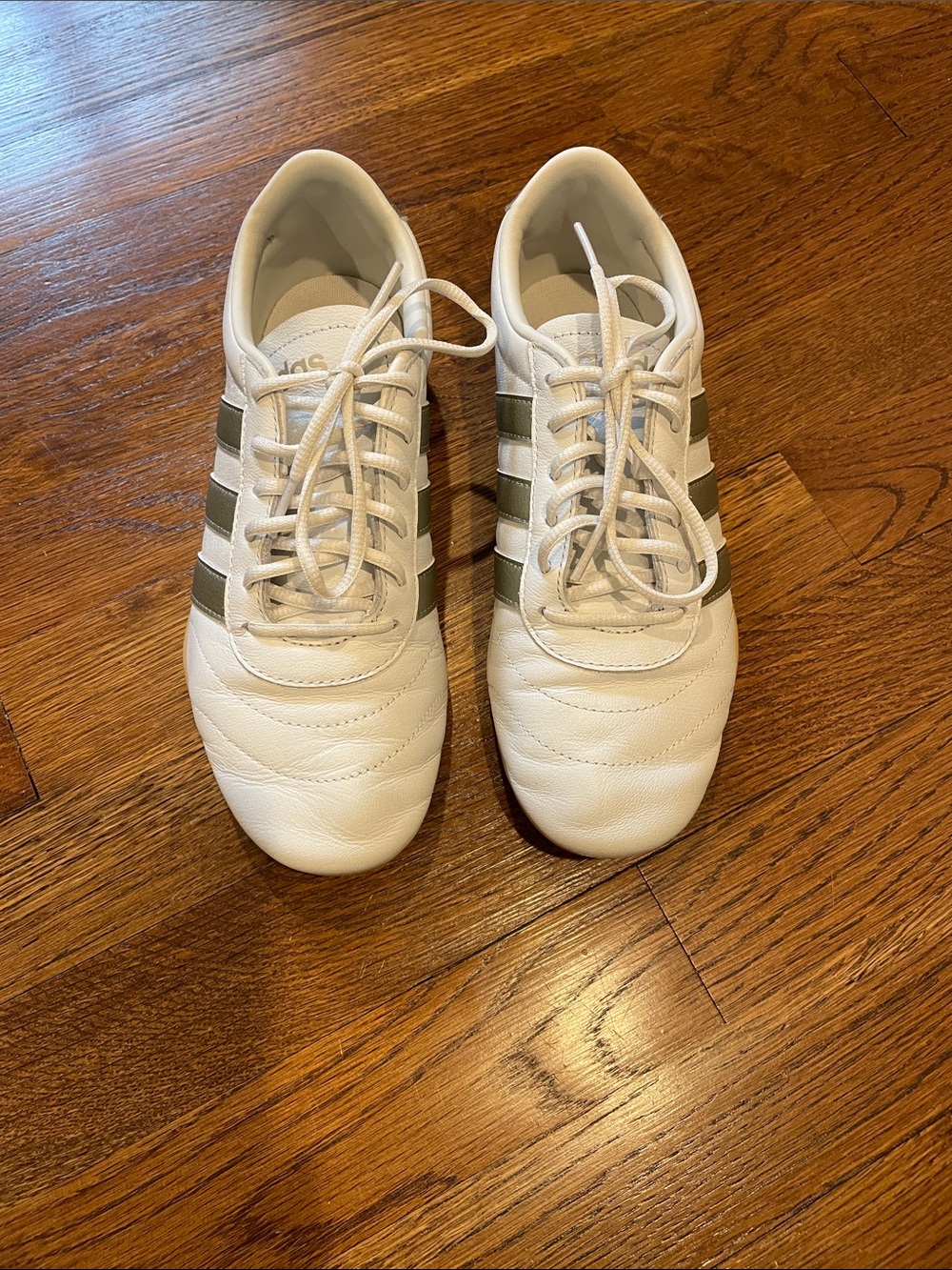 adidas low profile White Sneakers with gold Stripes